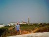Jamie in front of the monument and the stone buildings and hotel on Star Island, Isles of Shoals