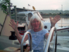 Ginny Bousum on her boat, Winsome I, on the dock Cook's Lobster House, Bailey Island, ME